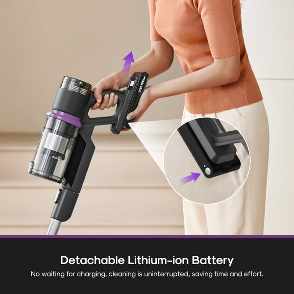 Person using a cordless vacuum cleaner with detachable lithium-ion battery feature.