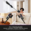 4-in-1 cleaning system vacuum being used on various surfaces with a woman in the background.