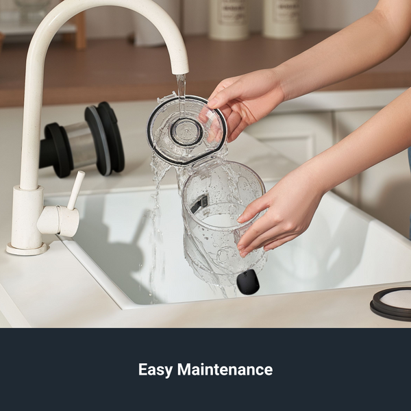 Person washing a glass under running water from a white faucet in a kitchen sink.