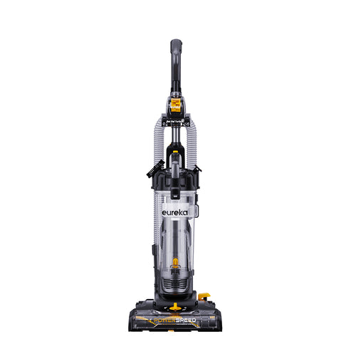A upright vacuum cleaner with gray body and yellow detailing, the brand Eureka is visible on the cleaner.