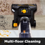 Vacuum cleaner cleaning a multi-floor surface with debris.